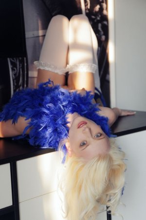 Blonde wearing sexy white stockings is having solo photo 19