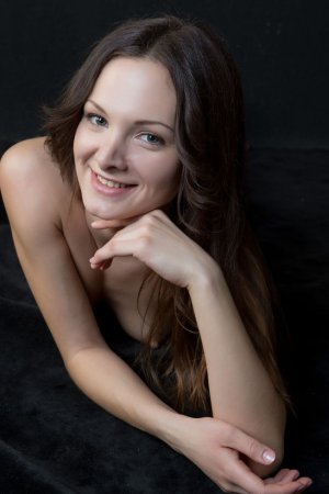 Busty babe is showing how flexible she is photo 2