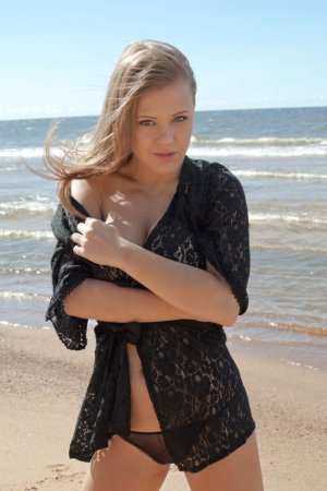Blondie allows sun to caress her shaved pussy. photo 3