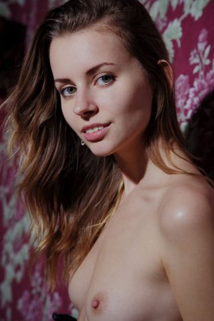 Babe takes off silk lingerie to lie naked in bed photo 18