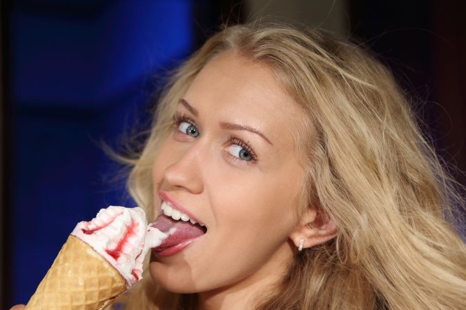 Blonde is eating ice-cream passionately photo 7