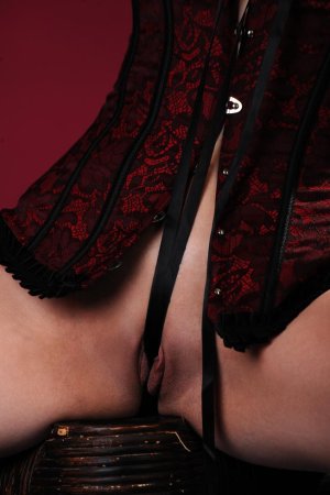 Blondie in corset rubs pussy with long beads. photo 13