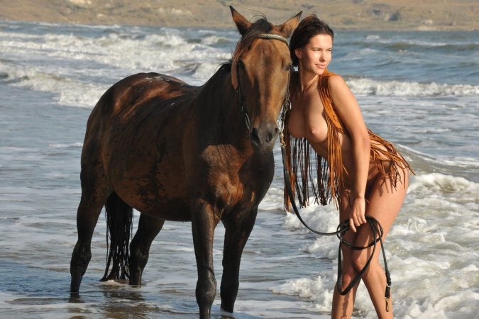 Brunette gal posing with her horse photo 8