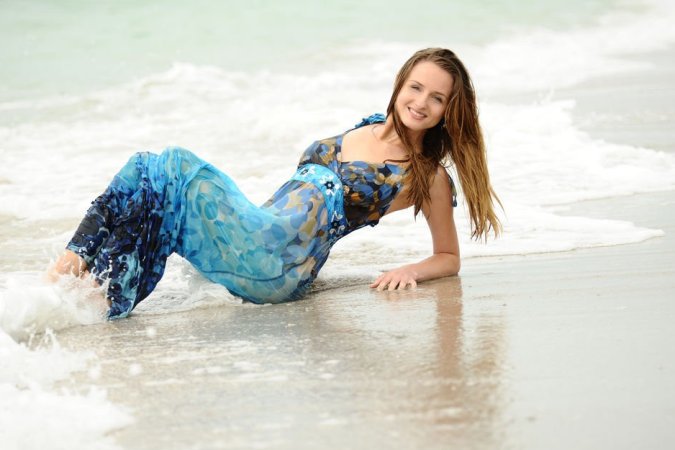 Loving the feel of the surf on her pussy photo 15
