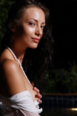 Sexy brunette posing in the pool photo 5