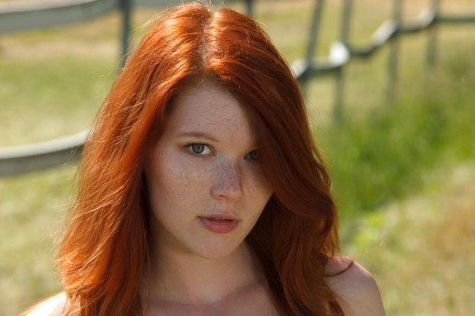 Naked red-haired babe poses in the field photo 20