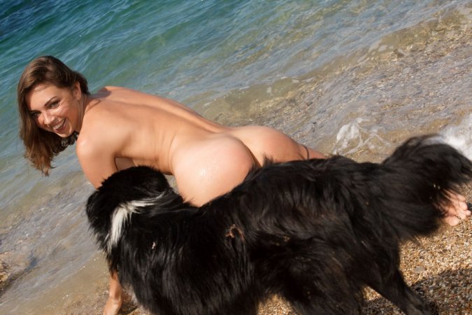 Babe wraps herself with fluffy towel at seaside. photo 12