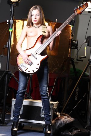 Amazingly hot blonde is playing the guitar photo 6