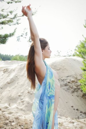 Sweet looking model showing off outdoors photo 1