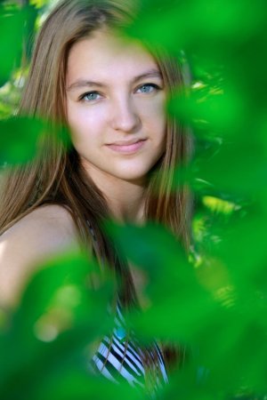 Young babe is enjoying solo in the forest photo 15
