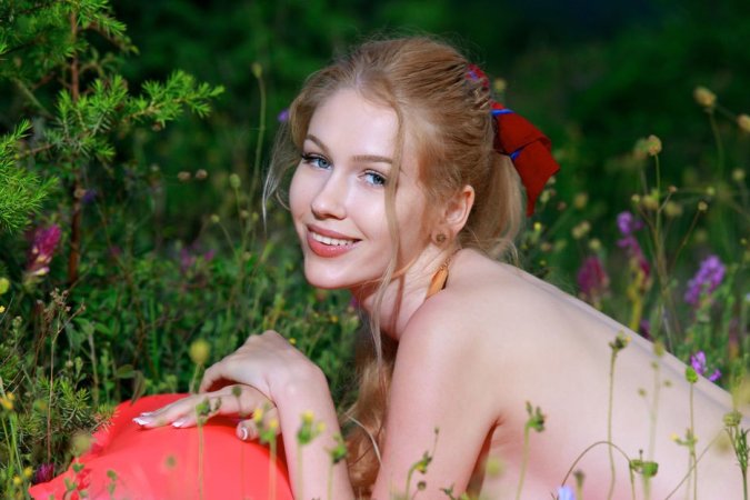 Cutie gets an orgasm in the field photo 3