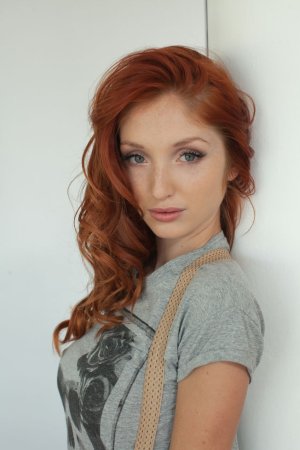 Redhead showing off her world class tits photo 20