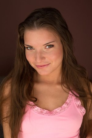 Smiling lady is pleasing herself photo 3