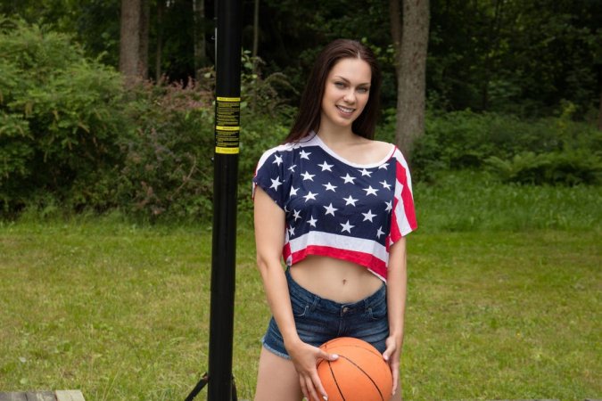 Brunette plays strip basketball outdoors photo 2