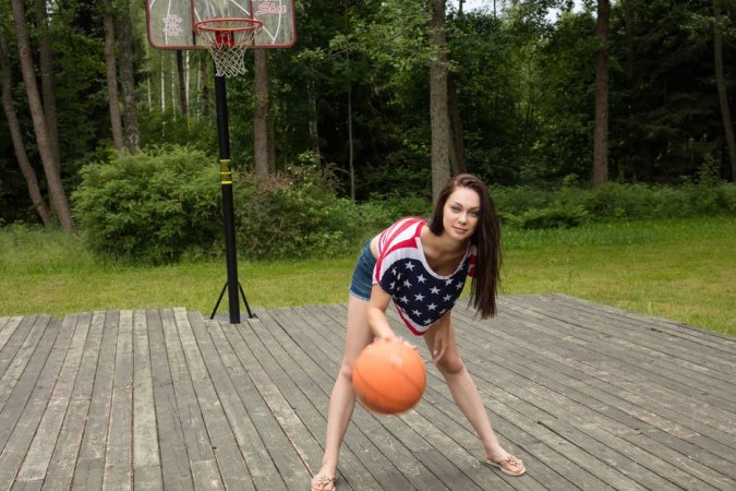 Brunette plays strip basketball outdoors photo 7