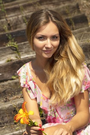 Naughty blonde pleases her wet pussy outdoors photo 2