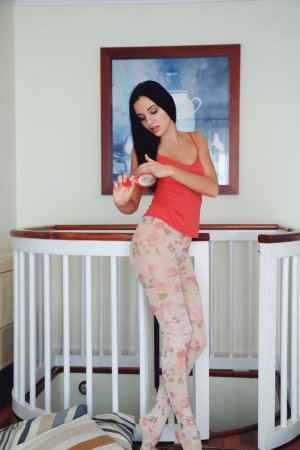 Dark-haired chick undresses during a workout photo 1