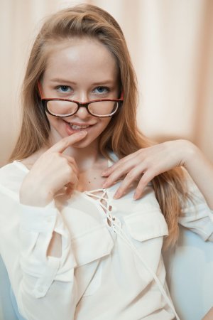 Cutie makes pictures of her shaved pussy photo 4