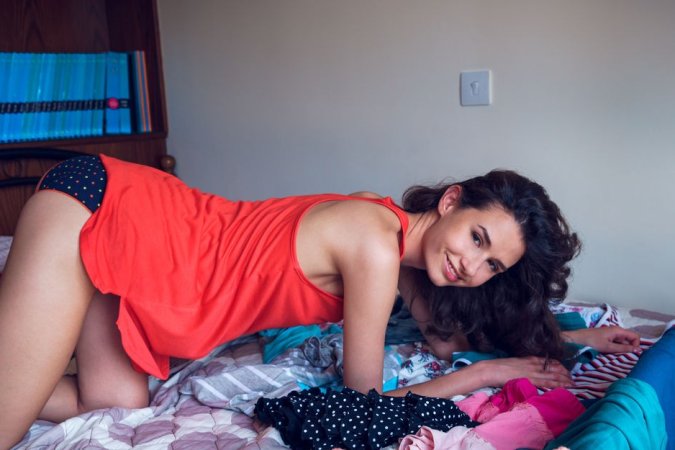 Sexy chick goes down on all fours on camera photo 14