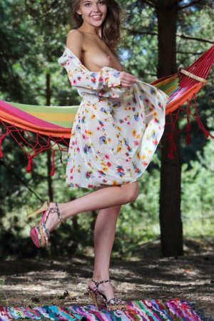 Brunette rubs shaved pussy in the hammock photo 7