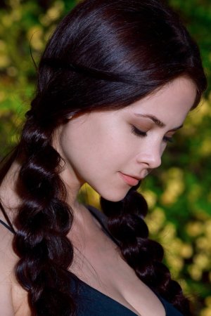 Dark-haired babe satisfies wet pussy outdoors photo 11