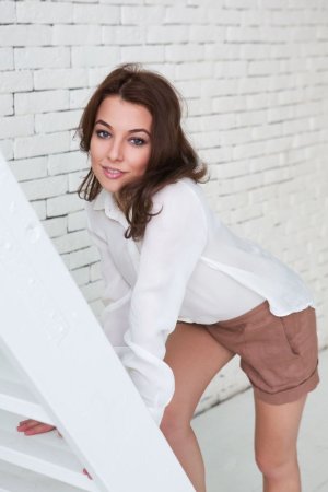 Naked dark-haired babe works out on the ladder photo 15