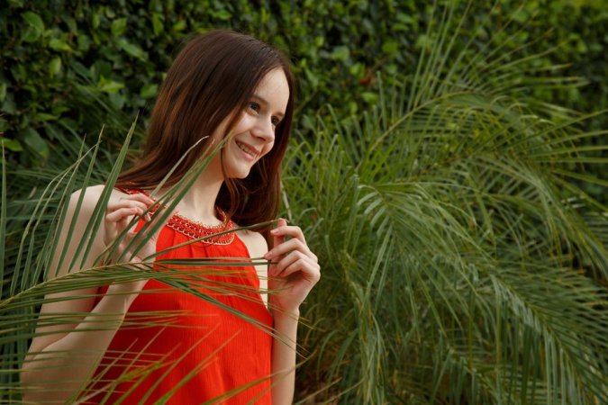 Dark-haired lady in red gets fantastic orgasm in garden photo 8