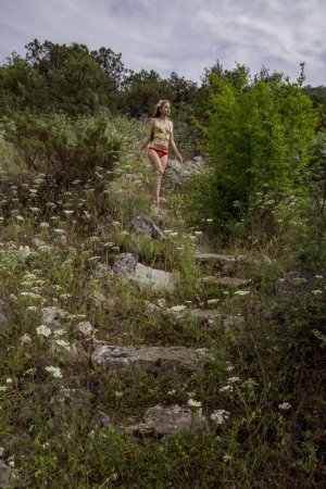 Sweetie plays naked in the field until she is satisfied photo 12