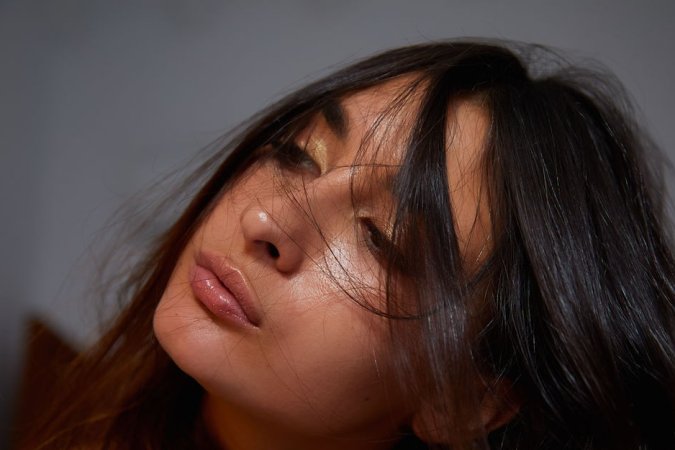 Dark-haired babe orgasms while putting on make-up photo 6