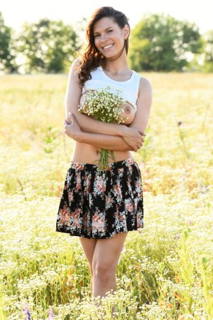 Brunette rubs her pussy in the field photo 11