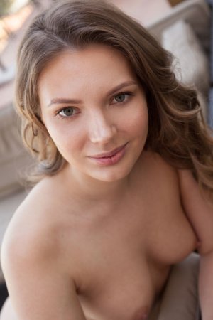 Hottie satisfies herself on the couch photo 16