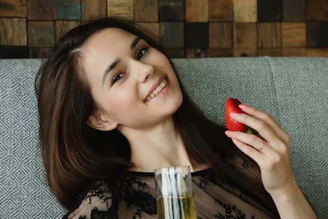 Slim babe masturbates when eating strawberry photo 2