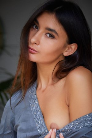Naked brunette shows the beauty of her pussy photo 5