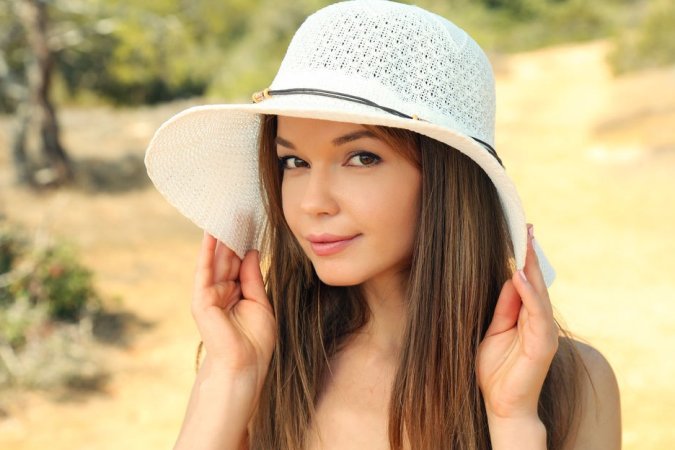 Naked cutie in hat goes up into the mountains photo 9
