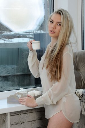 Blonde rubs pussy while drinking her coffee photo 13
