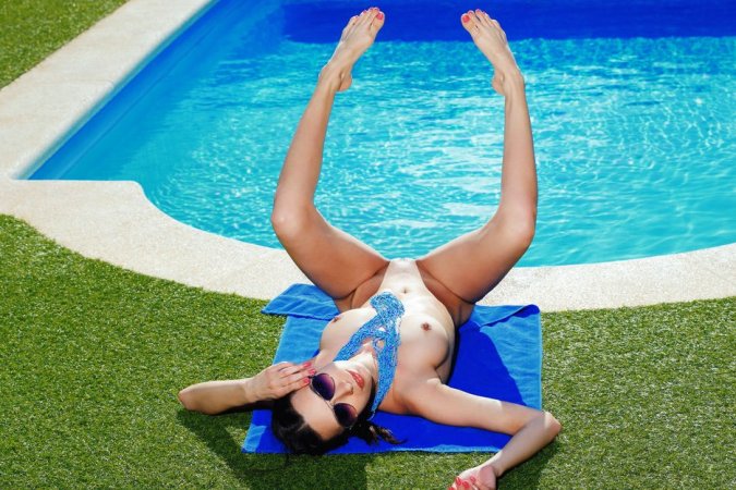 Skinny cutie works out naked at the outdoor pool photo 6