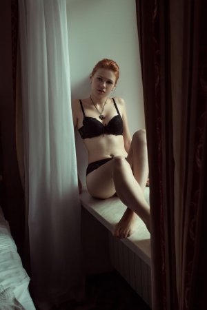 Red-haired chick takes off black lingerie set photo 14