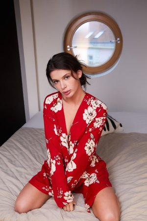 Asandra Dewy teases the neckline of her dress photo 3