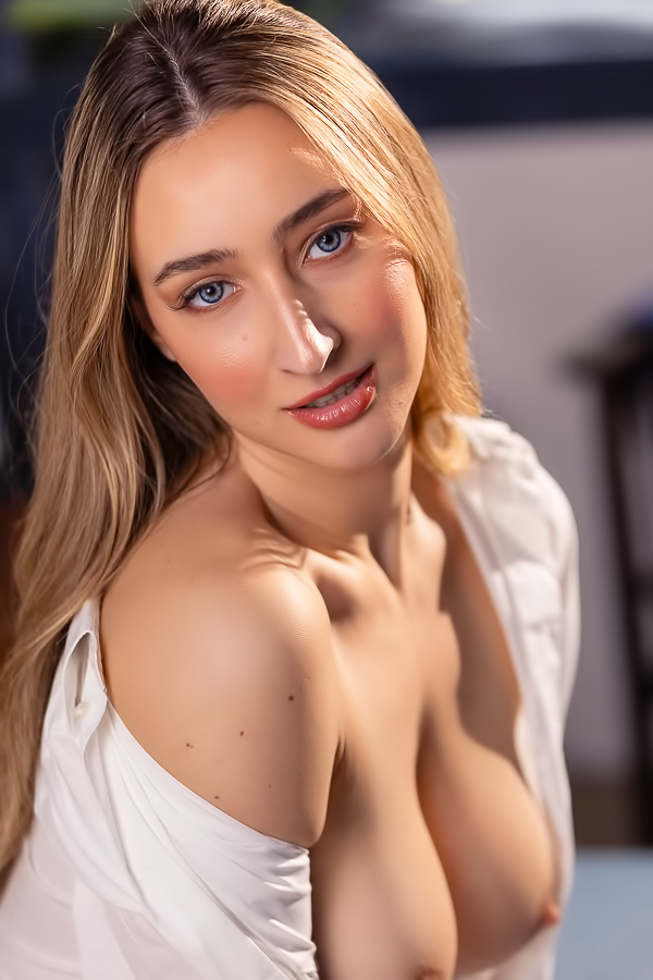 Lula Stocch stripping in bedroom scene