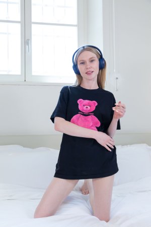 Monique Samson stretches out in a black T-shirt photo 2