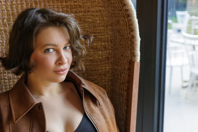 Lucy Dumas lounges seductively on the chair photo 1