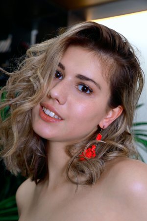 Marta Bella lounges seductively in a red bodysuit photo 6